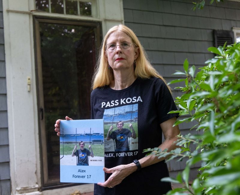 Sharon Winkler holds a photo of her son Alex at her home in Atlanta. PHIL SKINNER FOR THE ATLANTA JOURNAL-CONSTITUTION