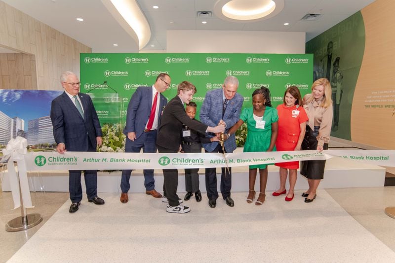 Children's Healthcare of Atlanta Arthur M. Blank Hospital held a ribbon cutting on Saturday, September 28, 2024, the day before the ER opened at 7 a.m. Sunday. Pictured here is Atlanta philanthropist Arthur Blank cutting the ribbon on the new hospital he helped fund. It is located at I-85 and N. Druid Hills Rd. in Atlanta. (Photo courtesy of CHOA)