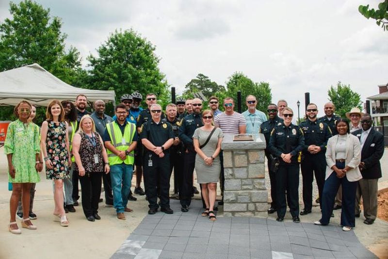 Lawrenceville officials gather for the dedication of HYRO Park at the Lawrenceville Lawn. The urban dog park is named for Lawrenceville Police K-9 Officer Hyro, who died in July from an illness. (Courtesy of City of Lawrenceville)