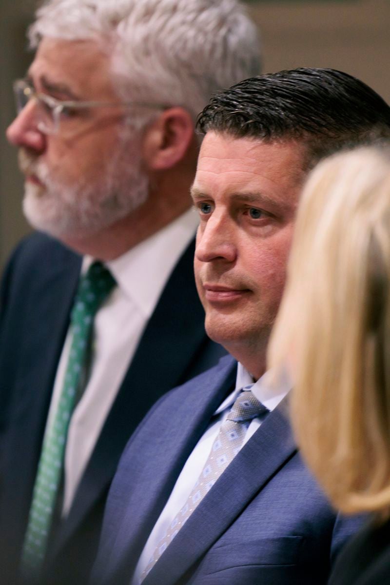 FILE - Auburn Police Officer Jeffrey Nelson, center, and defense attorney Tim Leary, behind, attend closing arguments, Thursday, June 20, 2024, at Maleng Regional Justice Center in Kent, Wash. A jury found the suburban Seattle police officer guilty of murder Thursday, June 27, in the 2019 shooting death of a homeless man outside a convenience store, marking the first conviction under a Washington state law easing prosecution of law enforcement officers for on-duty killings. (Erika Schultz/The Seattle Times via AP, File)