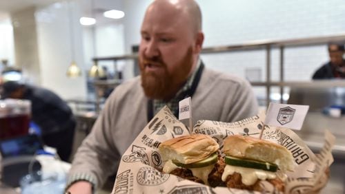 Chef Kevin Gillespie speaks to members of the press as Mercedes- Benz Stadium's food and beverage staff prepares their signature menu items for the Super Bowl LIII between New England Patriots and Los Angeles Rams on Tuesday, January 29, 2019.