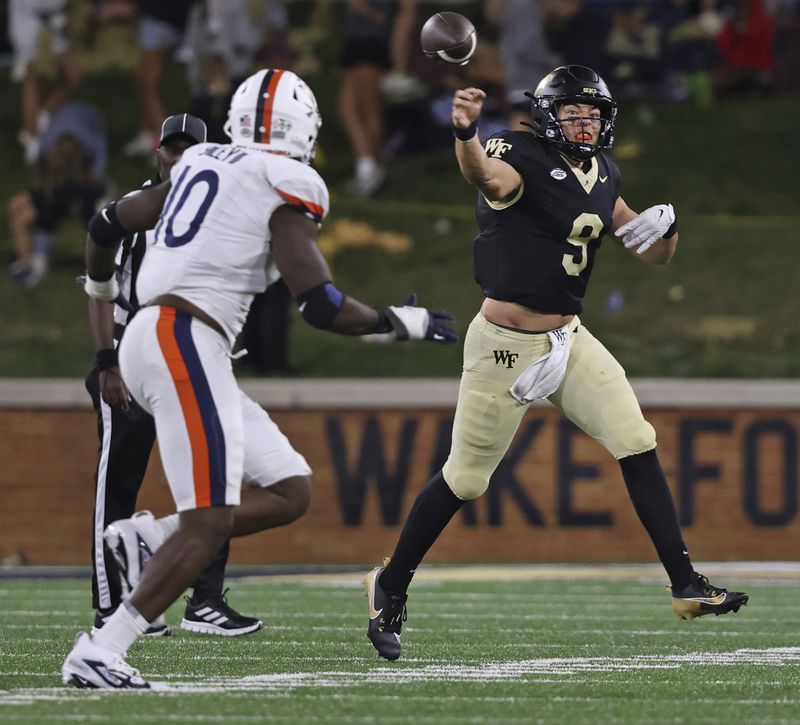 Wake Forest quarterback Hank Bachmeier throws on the run as he is pressured by Virginia defensive end Ben Smiley III during the second half of an NCAA college football game, Saturday, Sept. 7, 2024, in Winston-Salem, N.C. (Walt Unks/The Winston-Salem Journal via AP)