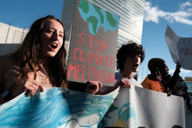 A group of students take part in a protest in support of the climate and against fossil fuel and other contributors to global warming in front of the United Nations (UN) in Manhattan on October 01, 2021 in New York City. (Photo Courtesy of Spencer Platt/Getty Images)