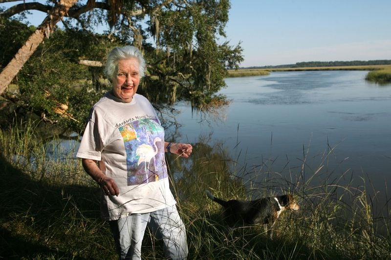 Eleanor Torrey " Sandy" West, during a 2006 visit at the age of 93, walks her dog Toby past Horseshoe Slough on the Bradley River, one of her favorite spots on the island, Thursday, Oct. 12, 2006, on Ossabaw Island, Ga. 
CURTIS COMPTON / THE ATLANTA JOURNAL-CONSTITUTION