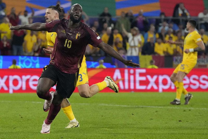 Belgium's Romelu Lukaku celebrates after scoring a later disallowed goal during a Group E match between Belgium and Romania at the Euro 2024 soccer tournament in Cologne, Germany, Saturday, June 22, 2024. (AP Photo/Martin Meissner)
