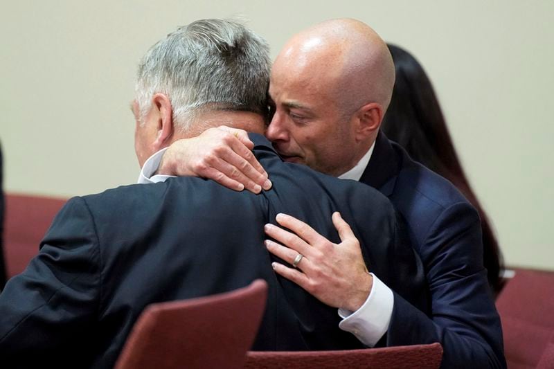 Attorney Luke Nikas, right, embraces actor Alec Baldwin during his trial for involuntary manslaughter for the 2021 fatal shooting of cinematographer Halyna Hutchins during filming of the Western movie "Rust," Friday, July 12, 2024, at Santa Fe County District Court in Santa Fe, N.M. The judge threw out the case against Baldwin in the middle of his trial and said it cannot be filed again. (Ramsay de Give/Pool Photo via AP)