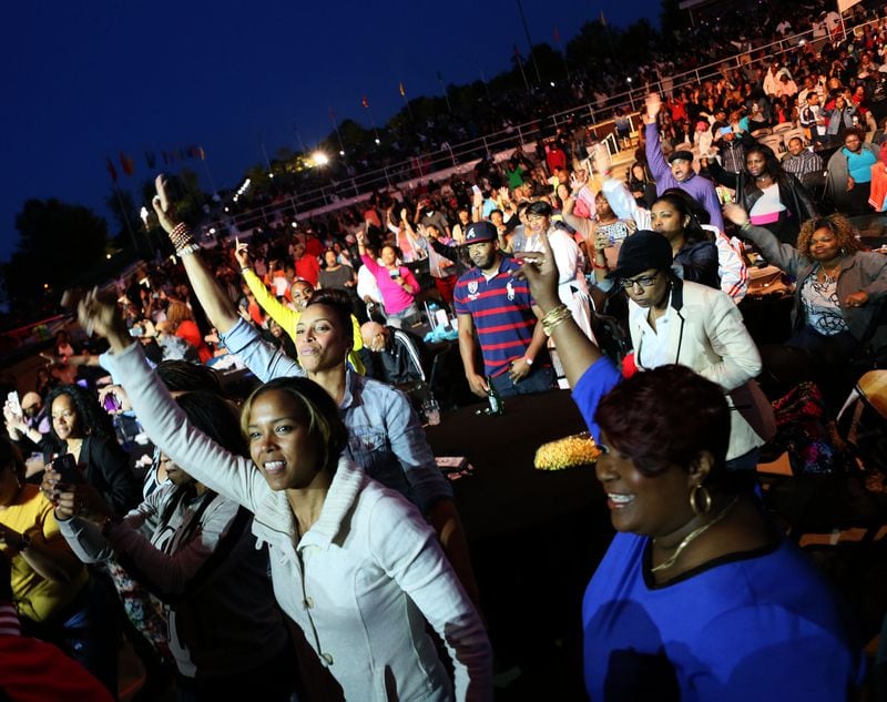 Enthusiastic fans get into the sounds of Goodie Mob at the Funk Fest at Wolf Creek Amphitheater on Friday. (Akili-Casundria Ramsess/Special to the AJC)