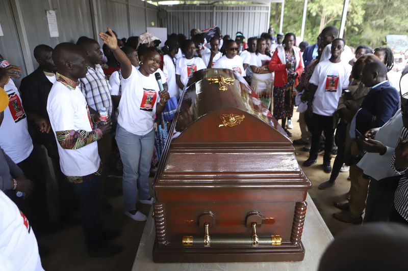 Relatives and friends view the body of Ugandan Olympic athlete Rebecca Cheptegei at Moi Teaching and Referral Hospital morgue in the western city of Eldoret, in Rift Valley, Kenya Friday, Sept. 13, 2024. (AP Photo/Andrew Kasuku)