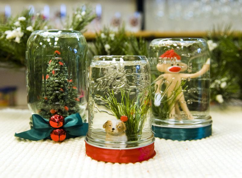 Using a Mason jar, water and glitter, you can create your own snow globe, like these at Zinger Hardware and General Merchant.