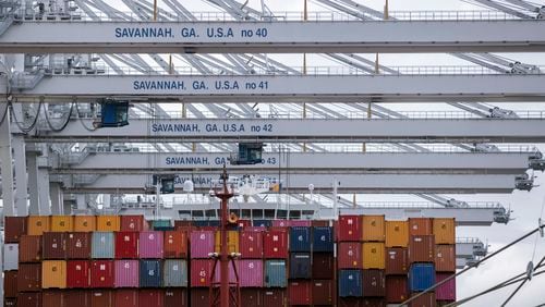 FILE - In this photo provided by the Georgia Ports Authority, a vessel is loaded with containers by several ship to shore crane at the Georgia Ports Authority's Port of Savannah Garden City Terminal, on Oct. 21, 2021, in Savannah, Ga. (Stephen B. Morton/Georgia Port Authority via AP, File)