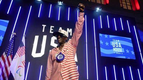 Flavor Flav gestures as he attends an interview with The Associated Press at the USA house ahead of the 2024 Summer Olympics, Thursday, July 25, 2024, in Paris, France. (AP Photo/Luca Bruno)