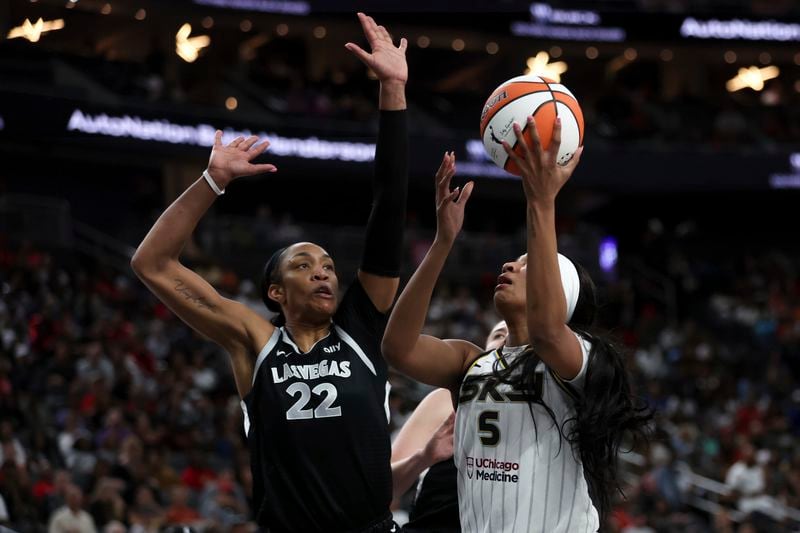 Chicago Sky forward Angel Reese (5) shoots against Las Vegas Aces center A'ja Wilson (22) during the first half of a WNBA basketball game on Tuesday, Sept. 3, 2024, in Las Vegas. (Ellen Schmidt/Las Vegas Review-Journal via AP)