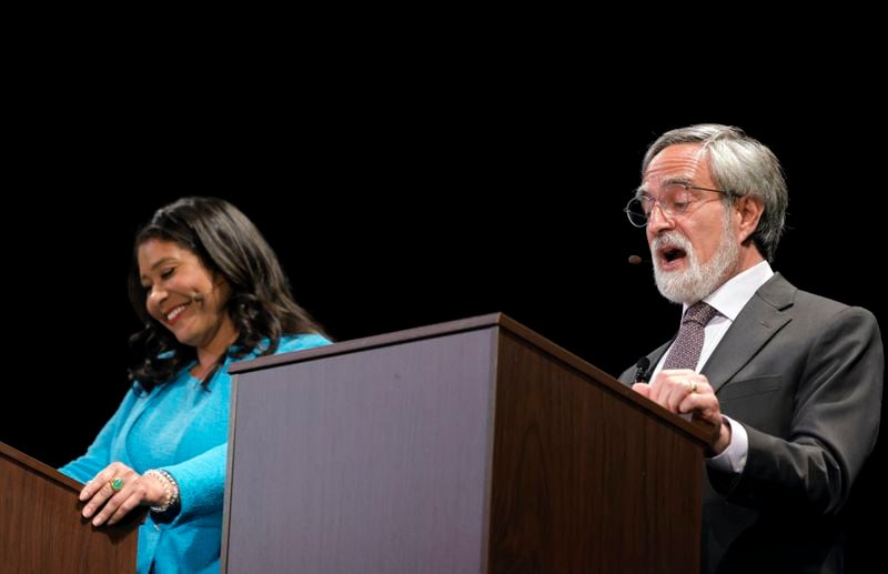 FILE - Candidate Aaron Peskin, right, answers a question as Mayor London Breed smiles during a debate for the top five mayoral candidates, at Sydney Goldstein Theater in San Francisco on Wednesday June 12, 2024. (Carlos Avila Gonzalez/San Francisco Chronicle via AP)