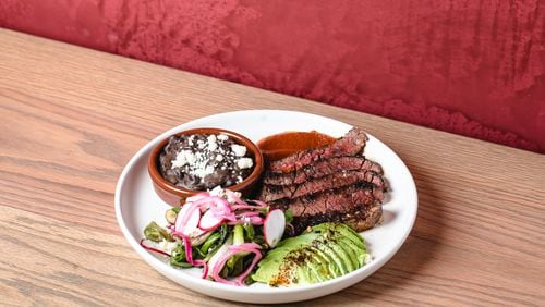 Carne asada with guajillo salsa, avocado, radish, black beans and tortillas from the Chicheria MX Kitchen menu.