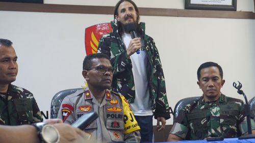 New Zealand pilot Phillip Mehrtens, center, who was held hostage for more than a year in the restive Papua region, talks to the media during a news conference after his release, in Timika, Papua province, Indonesia, Saturday, Sept. 21, 2024. (AP Photo/Endy Langobelen)