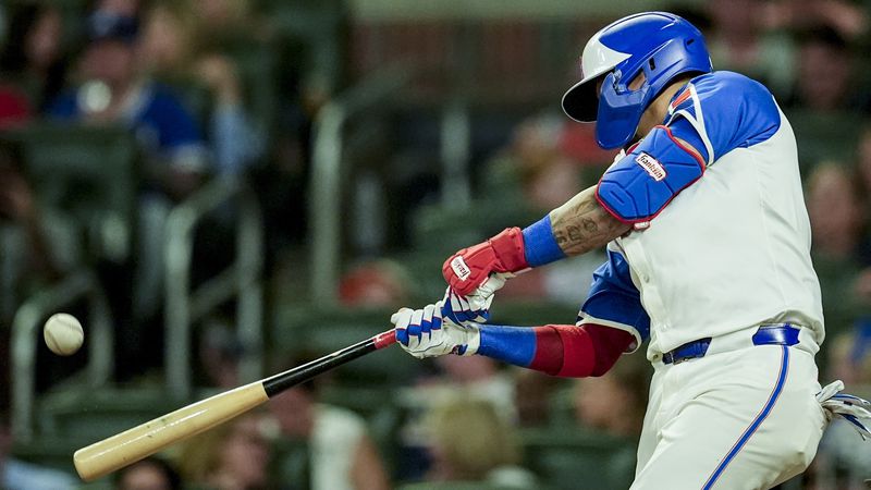 Atlanta Braves' Orlando Arcia (11) hits a solo homer against the Washington Nationals in the fifth inning of a baseball game, Saturday, Aug. 24, 2024, in Atlanta. (AP Photo/Mike Stewart)