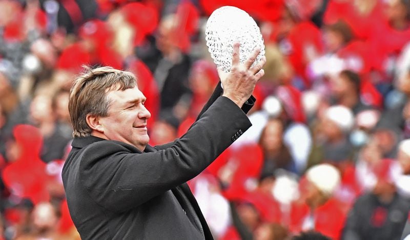 Georgia coach Kirby Smart holds up The Coaches’ Trophy during the celebration of Georgia’s College Football Playoff national championship at Sanford Stadium in Athens on Saturday, Jan. 15, 2022. (Hyosub Shin / Hyosub.Shin@ajc.com)