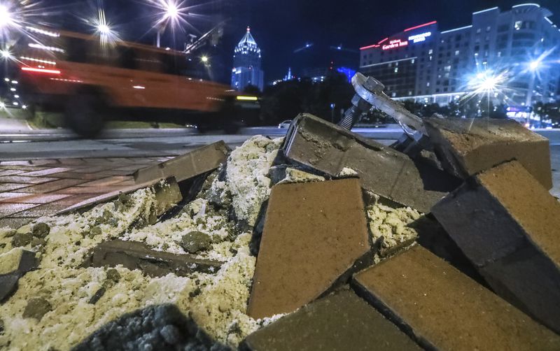 Debris sits on 10th Street NW near the Georgia Tech McCamish Pavilion several hours after the fatal crash that involved a speeding driver fleeing from a Georgia state trooper on Sept. 30, 2020. (John Spink/AJC 2020 photo)