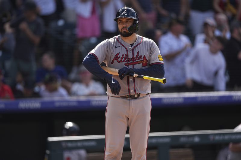 Atlanta Braves' Travis d'Arnaud stands at home plate after striking out against Colorado Rockies relief pitcher Victor Vodnik to end a baseball game Sunday, Aug. 11, 2024, in Denver. (AP Photo/David Zalubowski)