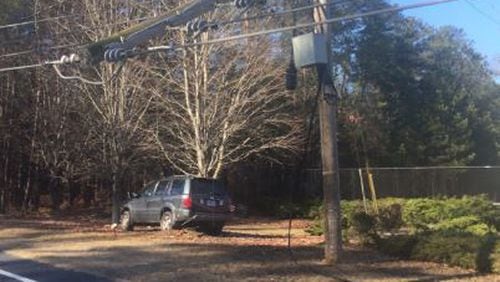 Old Norcross Road in Lawrenceville in Gwinnett County was expected to be closed until 5 or 7 p.m. Saturday after a car slid on ice and a powerline fell.