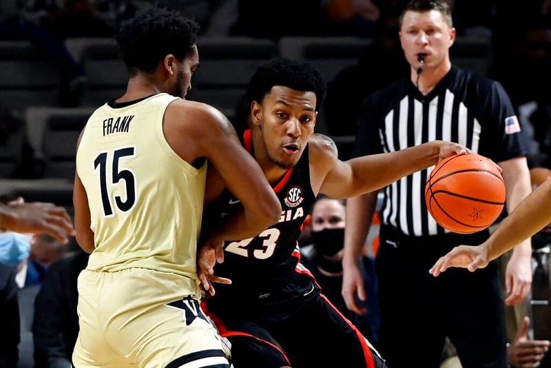 Georgia guard Braelen Bridges (23) is defended by Vanderbilt forward Terren Frank (15) during the first half of an NCAA college basketball game against Saturday, Jan. 29, 2022, in Nashville, Tenn. (AP Photo/Mark Zaleski)