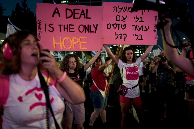 Activists and relatives of hostages held by Hamas militants in the Gaza Strip call for their immediate release and to protest against Israeli Prime Minister Benjamin Netanyahu's government in Tel Aviv, Israel, Saturday, Aug. 24, 2024. (AP Photo/Maya Alleruzzo)