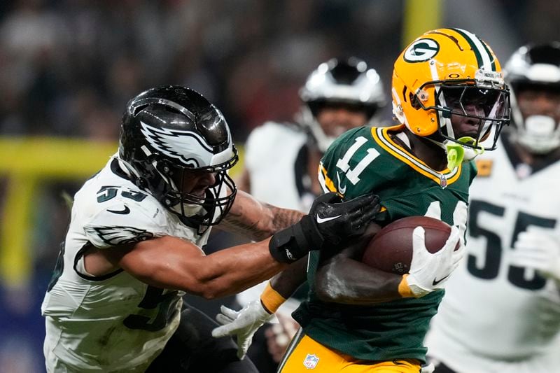 Green Bay Packers wide receiver Jayden Reed (11) breaks away from Philadelphia Eagles linebacker Zack Baun (53) during the first half of an NFL football game, Friday, Sept. 6, 2024, at the Neo Quimica Arena in Sao Paulo. (AP Photo/Andre Penner)