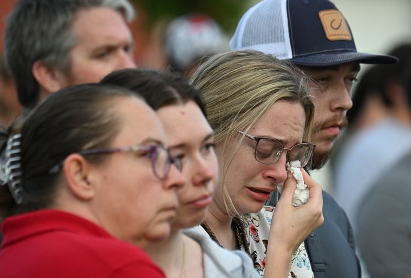 Mourners at a community vigil held Wednesday night at Winder's Jug Tavern Park.