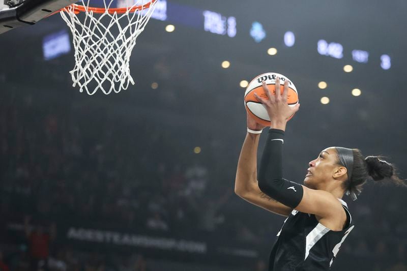 Las Vegas Aces center A'ja Wilson goes up for a basket during the first half of a WNBA Semifinal game against the New York Liberty, Sunday, Oct. 6, 2024, in Las Vegas. (AP Photo/Ian Maule)