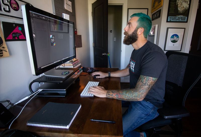  Buzz Busbee, owner of YEAHBUZZY, works in his home office in Atlanta, Ga, October 03, 2020.  STEVE SCHAEFER / SPECIAL TO THE AJC 