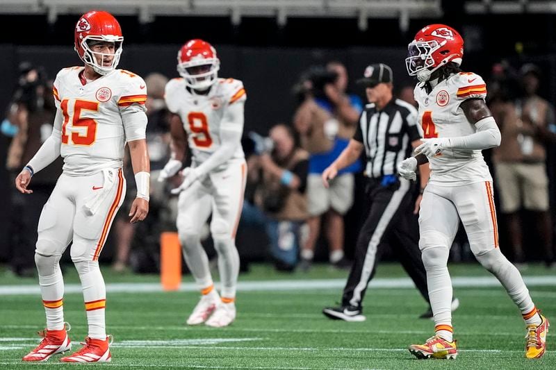 Kansas City Chiefs quarterback Patrick Mahomes (15) celebrates the touchdown by wide receiver Rashee Rice (4) during the first half of an NFL football game against the Atlanta Falcons, Sunday, Sept. 22, 2024, in Atlanta. (AP Photo/Brynn Anderson)