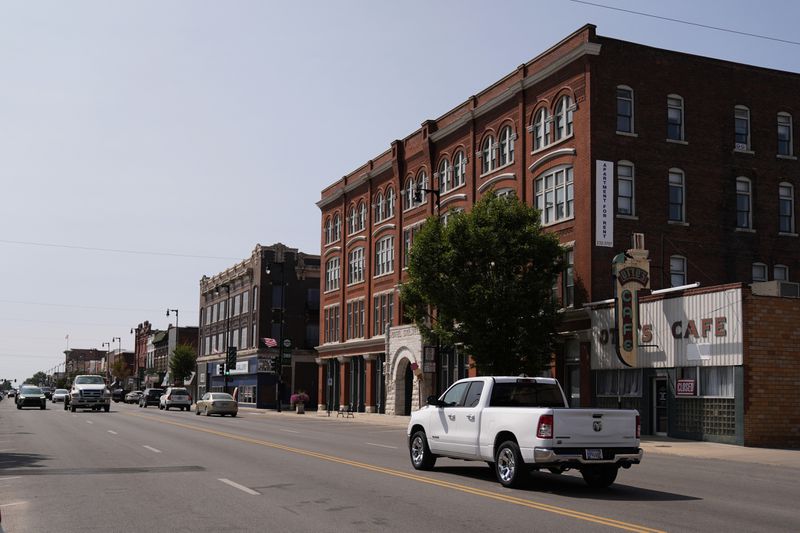 People drive through downtown Pittsburg, Kan., Tuesday, Sept. 10, 2024, that is home to a new Planned Parenthood clinic serving patients from Kansas as well as nearby Missouri, Oklahoma, Arkansas, Texas, and other states where abortions have become illegal or hard to get. (AP Photo/Charlie Riedel)