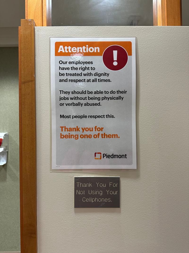 Piedmont Hospital utilizes signage to remind patrons that employees deserve to be able to do their jobs without being verbally or physically abused. Image credit: Nedra Rhone/nrhone@ajc.com