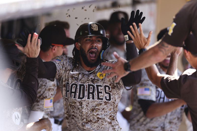 San Diego Padres' Fernando Tatis Jr. celebrates in the dugout after hitting a solo home run against the Chicago White Sox in the eighth inning of a baseball game, Sunday, Sept. 22, 2024, in San Diego. (AP Photo/Derrick Tuskan)