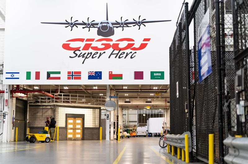 A sign commemorates the C-130J “Super Herc” cargo aircraft at Lockheed Martin's manufacturing facility in Marietta on Thursday, Aug. 22. (Seeger Gray/AJC)