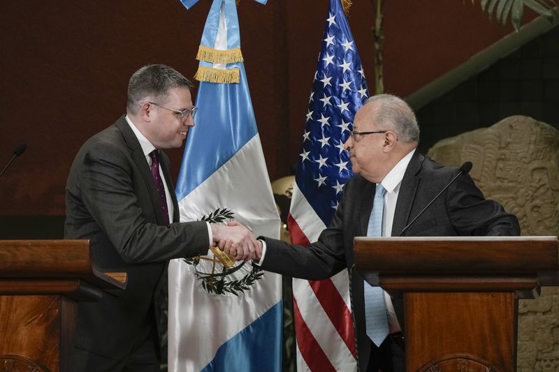 U.S. Deputy Assistant Secretary of State for Western Hemisphere Affairs Eric Jacobstein, left, and Guatemalan Foreign Minister Carlos Martinez, shake hands at the end of a press conference regarding the release of 135 Nicaraguan political prisoners, in Guatemala City, Thursday, Sept. 5, 2024. The U.S. government announced it secured the release of the political prisoners, who have arrived in Guatemala where they will apply for entry to the United States or other countries. (AP Photo/Moises Castillo)