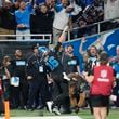 Detroit Lions quarterback Jared Goff tosses the football into the stands after his rushing touchdown during the second half of an NFL football game against the Seattle Seahawks, Monday, Sept. 30, 2024, in Detroit. (AP Photo/Paul Sancya)