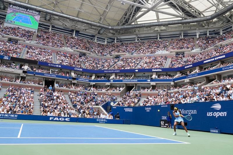 Coco Gauff, of the United States, returns a shot to Emma Navarro, of the United States, during the fourth round of the U.S. Open tennis championships, Sunday, Sept. 1, in New York. 2024. (AP Photo/Pamela Smith)