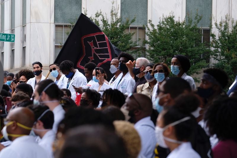 Demonstrators from the Morehouse School of Medicine arrive at the Georgia Capitol as they commemorate the 155th anniversary of Juneteenth on June 19, 2020. Ben Gray for the AJC/ Ben@bengray.com