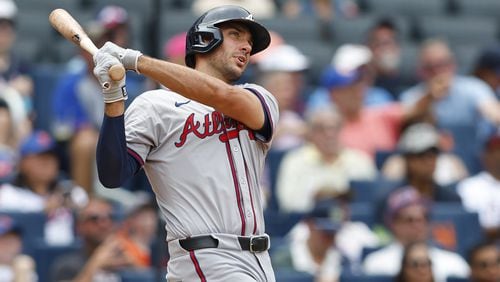 Matt Olson follows through on the swing that resulted in a three-run homer for the Braves in Sunday's win over the Mets.