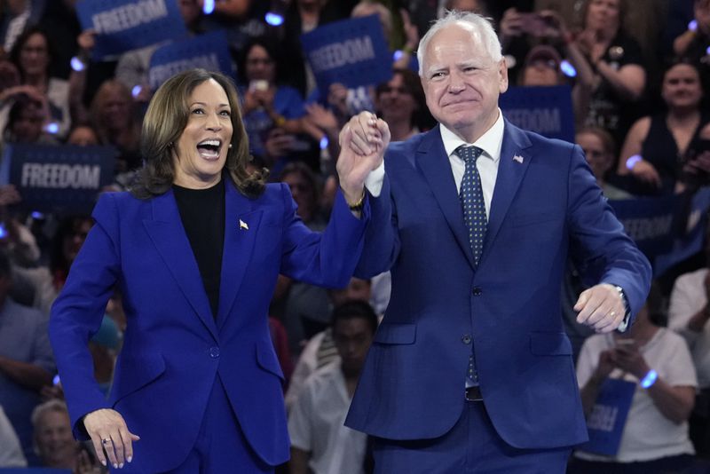 Democratic presidential nominee Vice President Kamala Harris and running mate Minnesota Gov. Tim Walz appear at the Fiserv Forum during a campaign rally in Milwaukee, Tuesday, Aug. 20, 2024. (AP Photo/Jacquelyn Martin)