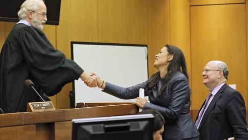 Attorney Charles Huddleston (right) and Meria Carstarphen, superintendent of Atlanta Public Schools, thank Judge Alan Harvey after his ruling. Fulton County court, DeKalb Judge Alan Harvey agreed to allow Fulton County to collect tax money after a plea from Fulton County Attorney Patrise Perkins-Hooker. The decision affects the cash flow of two school systems, 15 cities and Fulton County government. It stems from commissioners’ decision to freeze property taxes when values rose. BOB ANDRES /BANDRES@AJC.COM