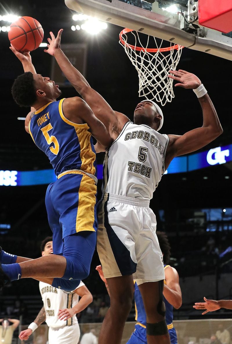 021421 Atlanta: Georgia Tech forward Moses Wright blocks a shot by Pittsburgh guard Au’Diese Toney in an NCAA college basketball game on Sunday, Feb 14, 2021, in Atlanta.      Curtis Compton / Curtis.Compton@ajc.com”