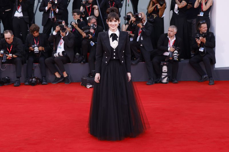 Winona Ryder poses for photographers upon arrival for the premiere of the film 'Beetlejuice Beetlejuice' and the opening ceremony of the 81st edition of the Venice Film Festival in Venice, Italy, on Wednesday, Aug. 28, 2024. (Photo by Vianney Le Caer/Invision/AP)