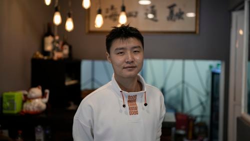 Owner Duan Fan poses in his Chinese restaurant “Nueve y media,” in the Roma Sur neighborhood of Mexico City, Friday, July 5, 2024. (AP Photo/Eduardo Verdugo)