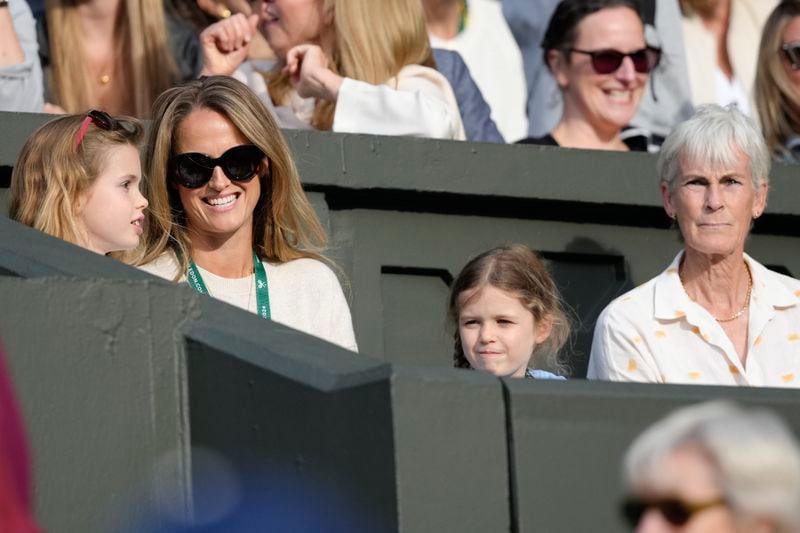 Kim Sears, wife of Andy Murray and his mother Judy wait in the players box ahead of the first round doubles match between Andy and Jamie Murray against Australia's John Peers and Ricky Hijikata at the Wimbledon tennis championships in London, Thursday, July 4, 2024. (AP Photo/Kirsty Wigglesworth)