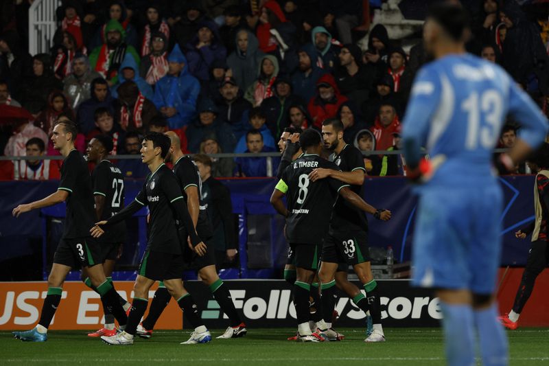 Feyenoord players celebrate after a goal during the Champions League soccer match between Girona and Feyenoord, in Girona, Spain, Wednesday, Oct. 2, 2024. (AP Photo/Joan Monfort)