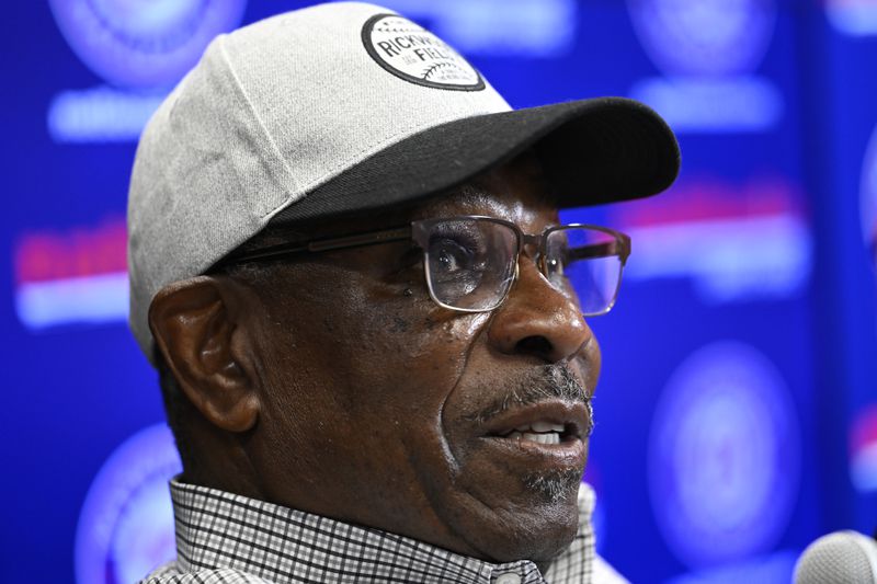 Former player and manager Dusty Baker talks with the media about his son Darren Baker first day in the major leagues with the Washington Nationals before a baseball game with the Chicago Cubs, Sunday, Sept. 1, 2024, in Washington. (AP Photo/John McDonnell)