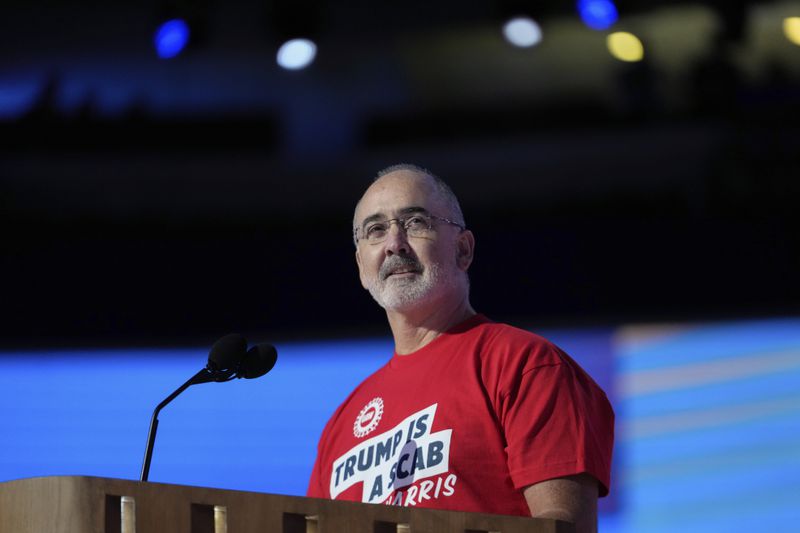 during the Democratic National Convention Monday, Aug. 19, 2024, in Chicago. (AP Photo/Paul Sancya)