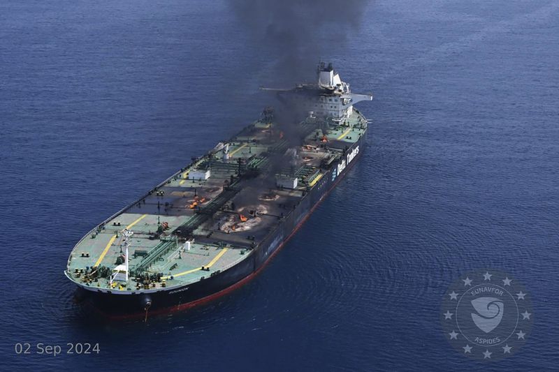 This photo released by the European Union's Operation Aspides naval force shows the Greek-flagged oil tanker Sounion burning in the Red Sea following a series of attacks by Yemen's Houthi rebels on Monday, Sept. 2, 2024. (European Union's Operation Aspides via AP)